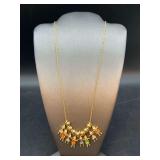 Beautiful gold tone necklace with children pendants and birthstones