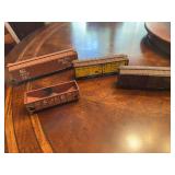 4 toy size train cars