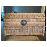Natural color wicker trunk filled with books, crayons, coloring books, etc……26-1/2 x 12 x 16 tall