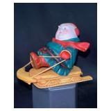 Dept. 56 porcelain Merry Makers Monk “Solomon the Sledder”…..4-1/2” long x 3-1/2” tall and in original box