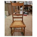 Vintage wooden rocker w/cane seat in excellent vintage condition...