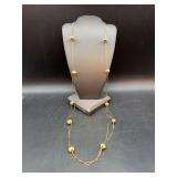 Elegant gold tone opera length necklace with ribbed cylindricals……can be doubled or more for shorter length