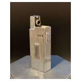 Silver tone ASR butane lighter…..not tested and latch does not open (requires hand opening)…..striker not working