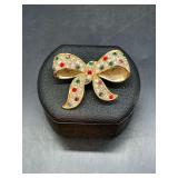 Beautiful and sparkly bow Christmas brooch with multi-colored rhinestones