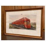 Framed print depicting a Frisco E-Unit diesel locomotive, specifically unit number 2006…..27-7/8 x 18-3/4…..frame has minor blemishes
