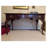 Statton Americana Trutype Queen Anne style cherry desk with 2 side drawers and 1 center drawer…..left front foot has piece missing…..57-1/2 x 27-1/2 x 29-1/2 tall