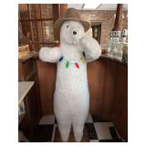 Standing Hen House brand polar bear with string of lights and hat…..Bear is super soft and was use as a greeter at the bar in sun room….56-1/2” tall….arms are jointed