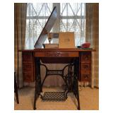 Rare Antique Singer Treadle Sewing Machine with 7 drawer…..ornate wood carving design…..treadle moves freely; however, machine will not stand up straight when lifted