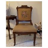Antique Victorian carved walnut tapestry chair with original casters…..18-1/2 x 16 deep x 34-3/4 tall overall