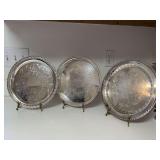 Grouping of (3) round silver plate serving trays….10-1/4”, 10” and 10”…..makers are Wm ￼Rogers & F.B. Rogers