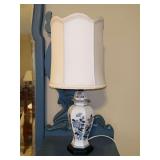 Chinoiserie-style lamp, often referred to as a ginger jar lamp featuring a blue and white floral pattern and elegant scalloped edge shade…..working condition…..￼19” tall