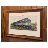 Framed print depicting F7 diesel locomotive, specifically unit number 800. This type of locomotive was built by the Electro-Motive Division of General Motors…..27-1/2 x 20-1/2…..frame has blemishe