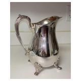 Great looking silver plate footed water pitcher with ice guard…..8-1/2” tall