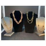 Lovely grouping of gold tone single and multi-strand necklaces