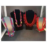 Grouping of brightly colored beaded necklaces