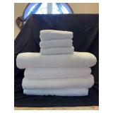 Grouping of 4 NEW white bath towels and 3 NEW hand towels