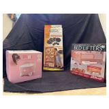 Grouping of (3) household items…..L2R….PIXI Cat Drinking Fountain, Sliding Robots and solid wood bed lifters