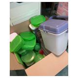 Box full of plastic storage containers, canisters and more