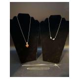 (4) pieces of sterling jewelry…..from left - both chain and pendant are sterling (7 grams), chain is sterling with beautiful blue and white glass beads, chain with bow is sterling and clasp needs re