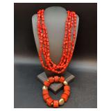 Matching coral colored beaded multi-strand necklace and bracelet