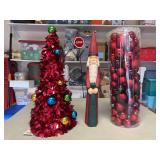 Wire cone Christmas tree, 18-1/2” tall wood Santa and a sleeve of various size red ornaments…..BACKGROUND CONTENTS NOT INCLUDED