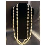 Very long strand of heavy pearl-like beaded necklace from Chico’s