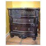 Ashley Britannia Rose Nightstand 3 drawer Black Rose Finish with marble top. 34 1/4" T x 34 1/2" W x 20" D. Good condition. Located on 2nd floor. This piece is heavy. BUYER IS RESPONSIBLE FOR REMOVAL.
