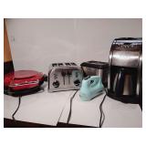 Group Small Appliances, George Foreman Grill, Cuisinart 4 slice toaster, Cuisinart Compact Deep Fryer, Kitchen Aid 5 speed hand mixer, missing mixing tongs, Cuisinart Automatic Grind & Brew Coffee Mak