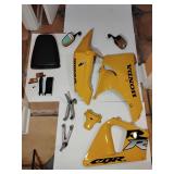 1998 HONDA CBR 900RR Selection of body parts, 3 cowls, pair of mirrors, rear passenger seat, frame covers, marking reflectors, pair rear foot pegs and brackets, rear fairing cover. Genuine HONDA Parts