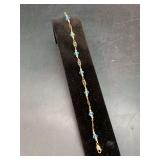 Delicately designed 14KGP bracelet with gold-tones and light blue beads…..7”