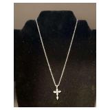 Great looking silver tone dainty necklace with rhinestone encrusted cross pendant
