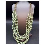Multi-strand green and gold beaded necklace