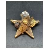 Two-tone star brooch with seaside theme