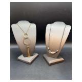 (2) costume necklaces…..left is longer gold-tine with interlocking rings and tassel…..right is a cord with “GRAMMY” letter blocks