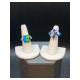 (2) handcrafted glass beaded rings with turquoise color accent beads…..left is size 7 and right has adjustable size