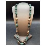 Can be dressed up or down…..nice looking beaded necklace….beads are a turquoise and gold-tone ornate