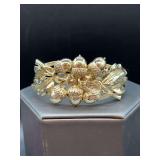 Gold-tone hinged bracelet with acorn and leaf motif…..shows slight wear