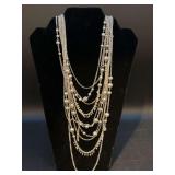 Dress it up or down…..elegant multi-strand silver-tone necklace with silver beading