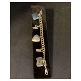 7” sterling charm bracelet with 2 sterling charms…..2 charms on each end and heart charm are not sterling
