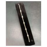 Nice looking rope link bracelet with heart shaped clear stones and sterling clasp…..7” long