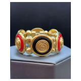 Vintage Liz Claiborne gold-tone stretch bracelet with red and black enamel panels and a nautical crest