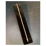 Sterling tennis bracelet with clear stones…..7” and 11 grams