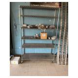 Aluminum rolling rack with six shelves. Contents are not included.