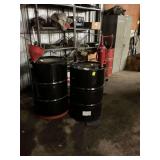 Two oil barrels, one on Rolling stand. ￼ does have some oil.