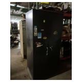 Black two-door metal cabinet, including contents. 36 x 24 x 78.