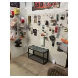 Group of miscellaneous motorcycle parts on hanging wall. See all photos.