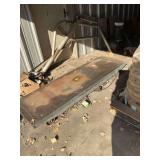 Motorcycle lift in outside shop, untested