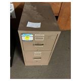 Tan two drawer file cabinet 15 x 29 x 26. Office supplies included.