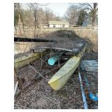 Yellow catamaran, approximately 20 foot long on flats.