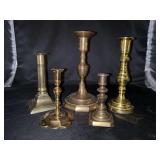 Grouping of brass candlesticks….heights range from 4-1/2” to 8-1/2” tall